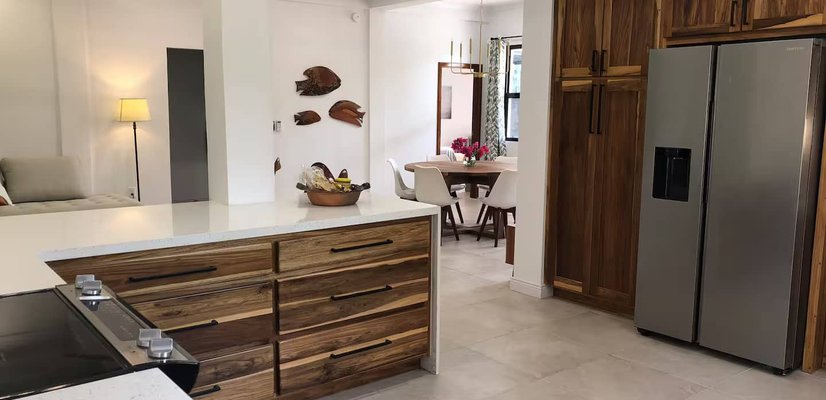 Modern kitchen with wood cabinetry and stainless appliances